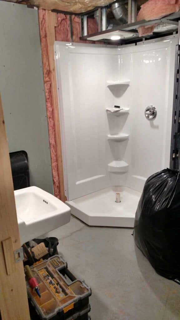 Downstairs Bathroom Part 3 https://www.b4andafters.com corner shower surround
