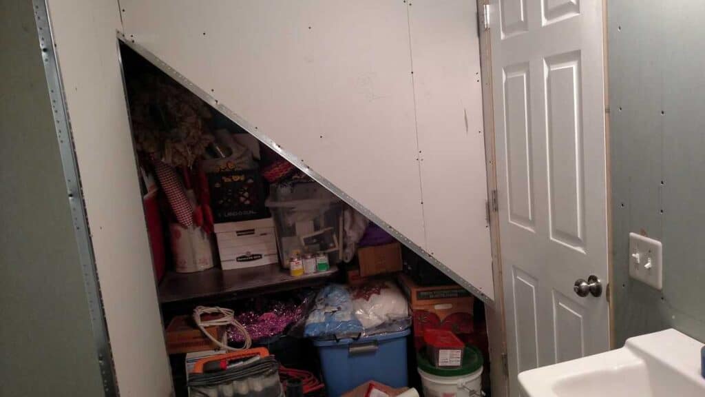 triangle opening of closet under stairs