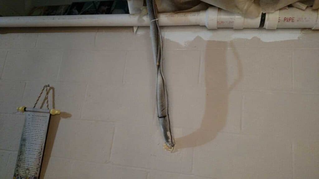 plain ugly basement pipe on wall