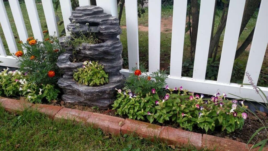 Repurposed Waterfall http://www.b4andafters.com pretty waterfall fountain as a flower planter