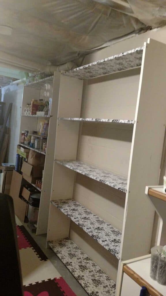Basement Shelves http://www.b4andafters.com contact paper covered shelves