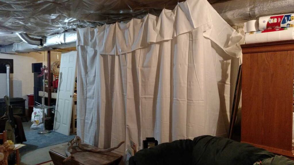 Organize With Curtains http://www.b4andafters.com curtains hiding messy basement