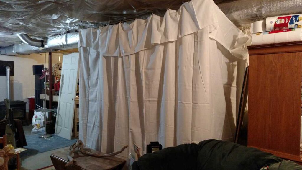 curtains hiding messy basement