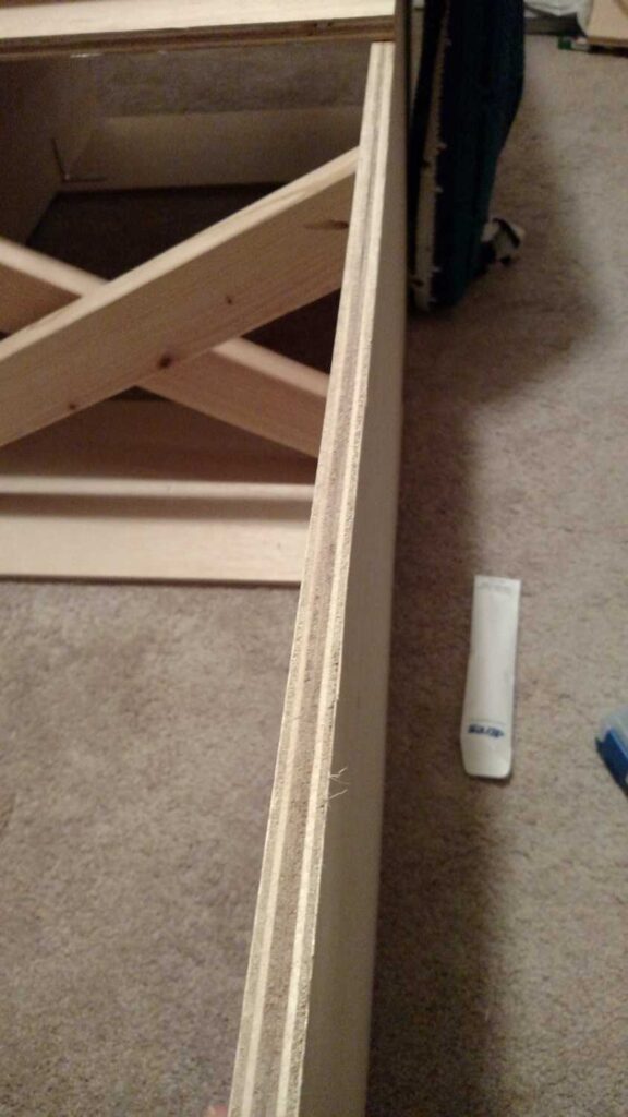 view showing how the screws do not go through the footboard of storage bed