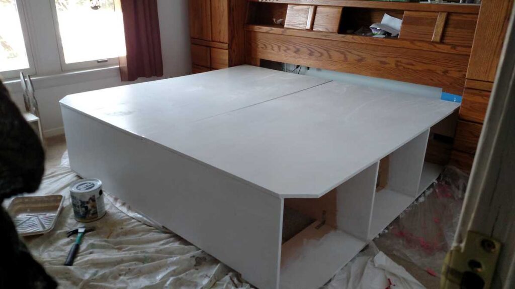 platform storage bed painted in white