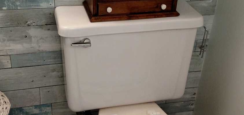 wallpapered toilet lid