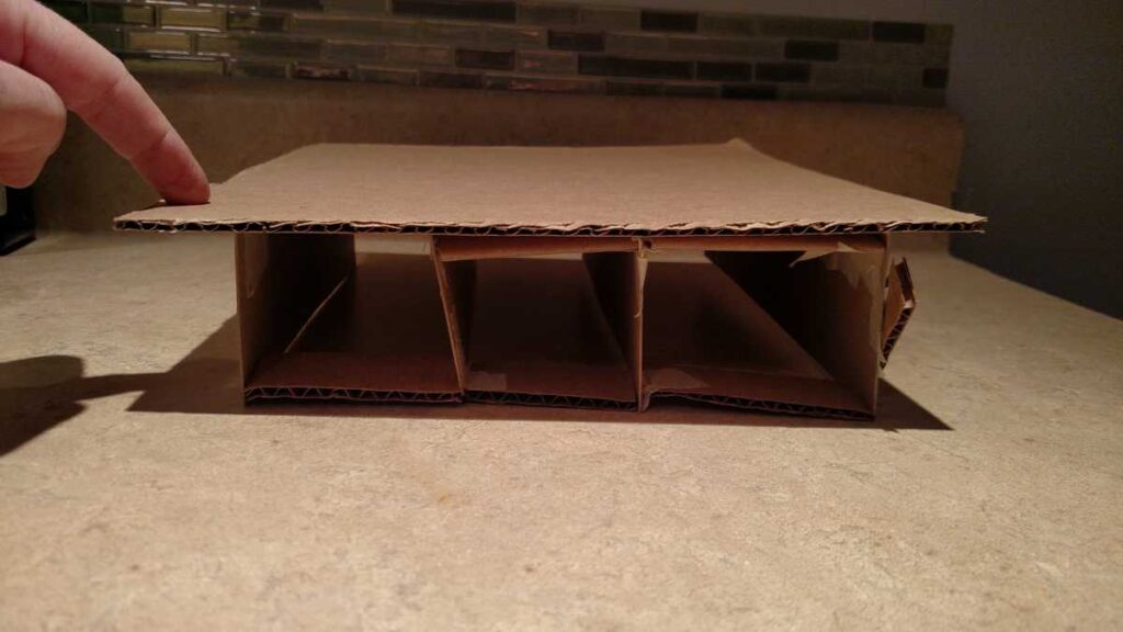 cardboard model of a storage bed