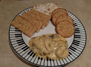 mushroom cheese dip with 3 different kinds of crackers