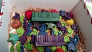 ots of various crayon shapes in music notes, a green keyboard, a purple keyboard