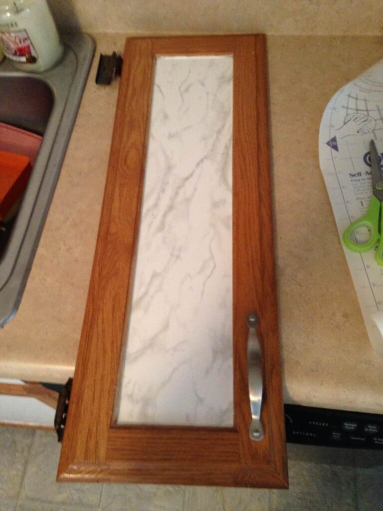 Contact Papering the Kitchen Cabinet Doors http://www.b4andafters.com cabinet door with contact paper in the center