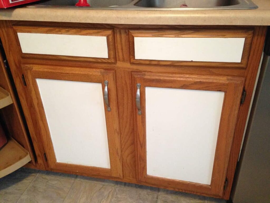 Contact Papering the Kitchen Cabinet Doors http://www.b4andafters.com doors painted white in the center