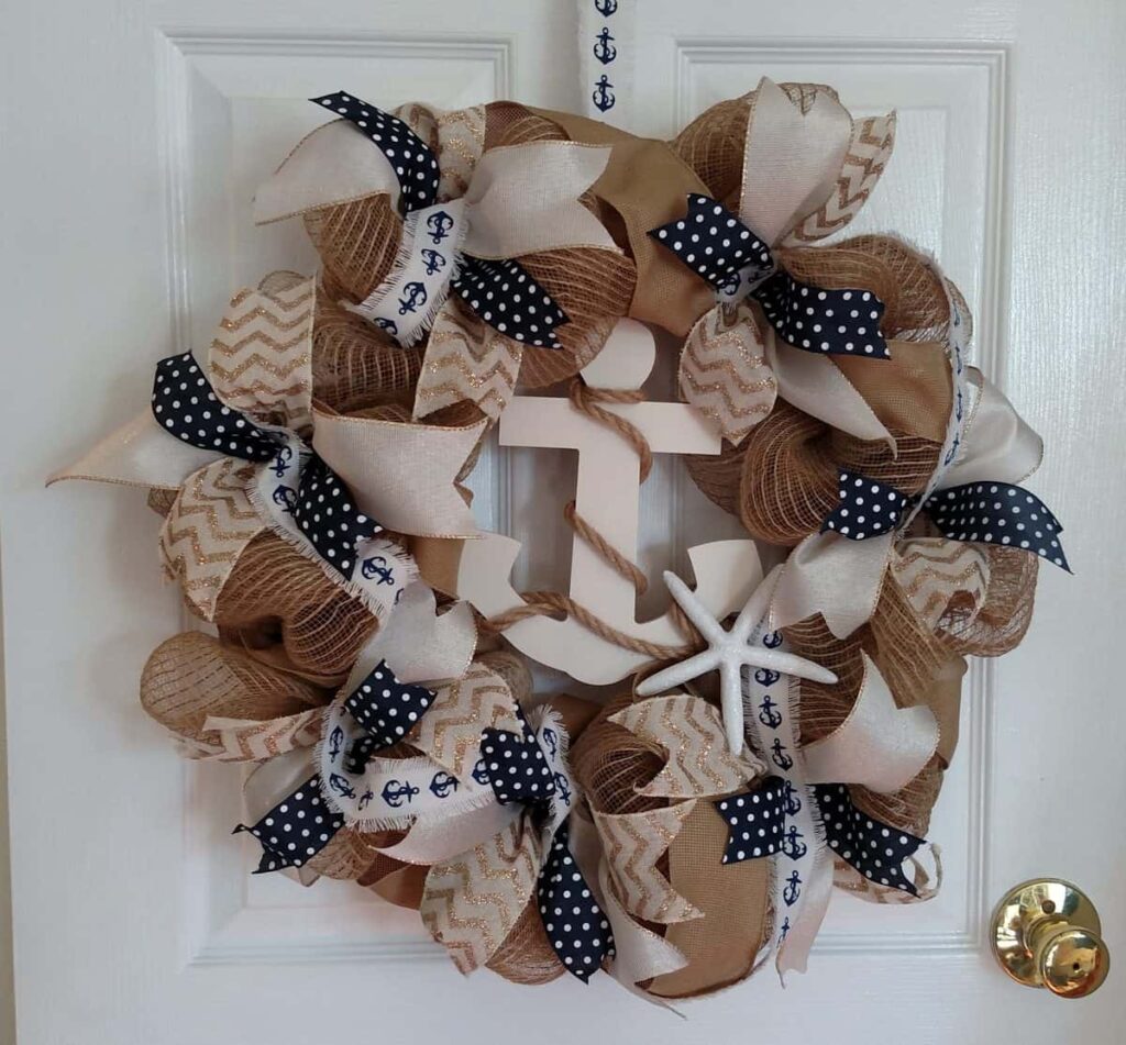 a nautical themed wreath with an anchor and rope in the center