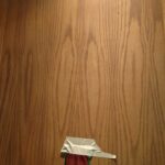 masking tape holding ribbon to door