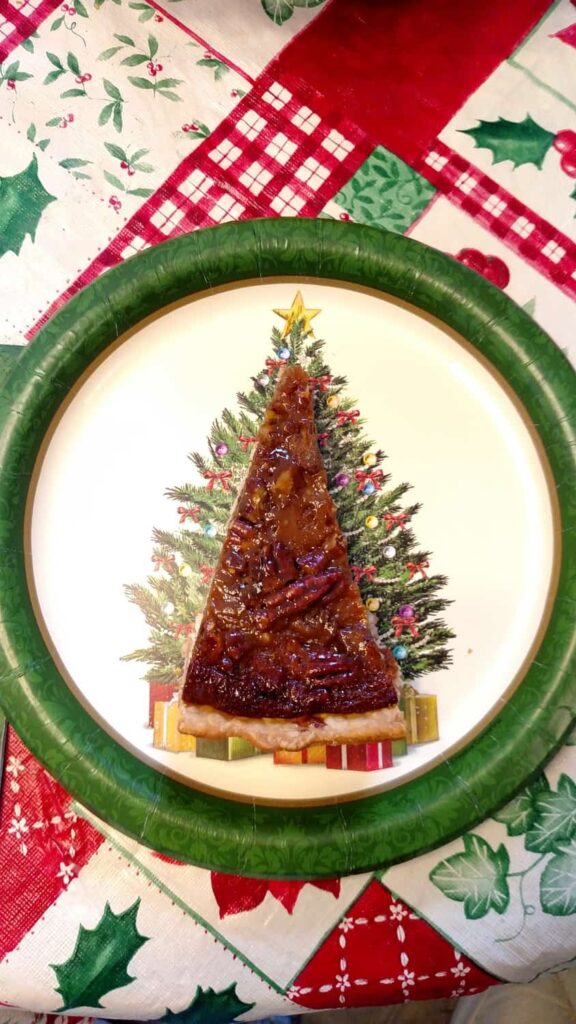 piece of pie on a Christmas tree paper plate