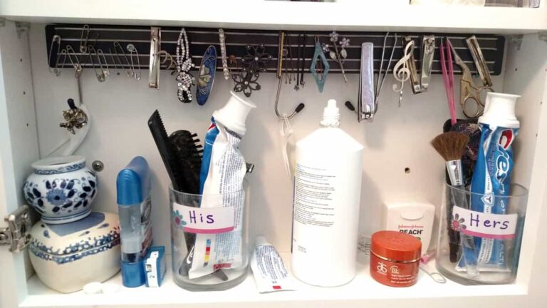 magnetic strip in medicine cabinet with lots of toothpaste tubes, contact cleanser, etc.