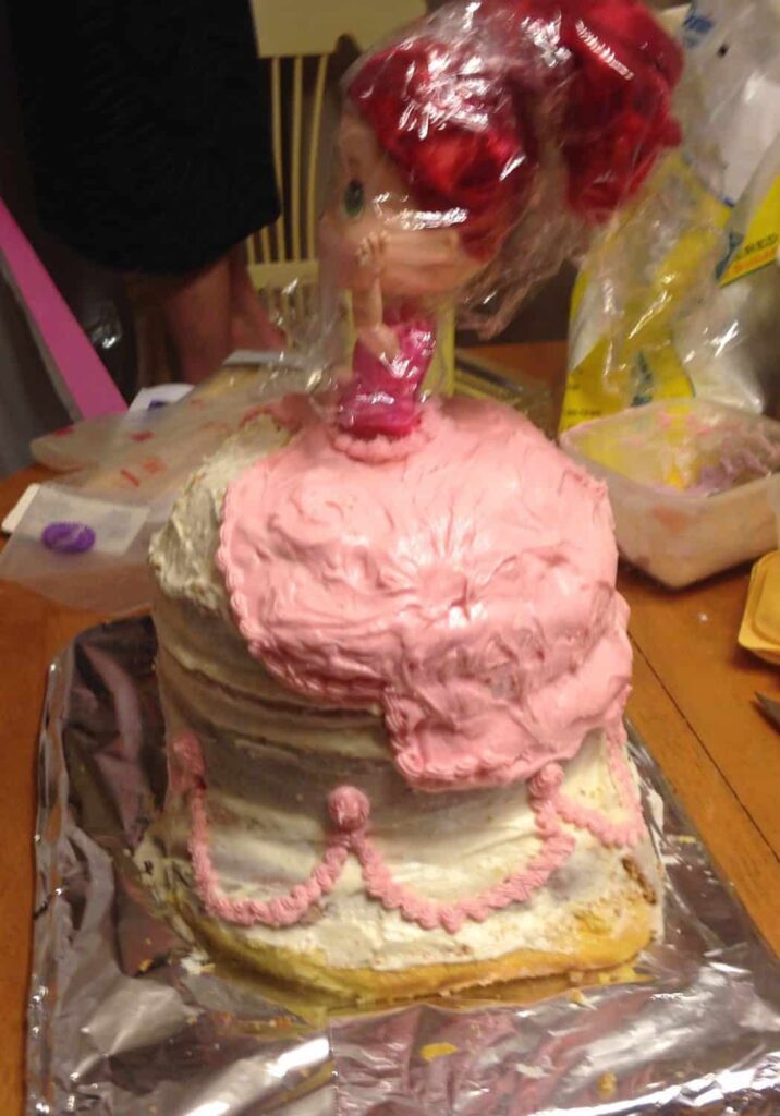 Strawberry Shortcake Doll Princess Cake https://www.b4andafters.com pink frosting on a doll cake