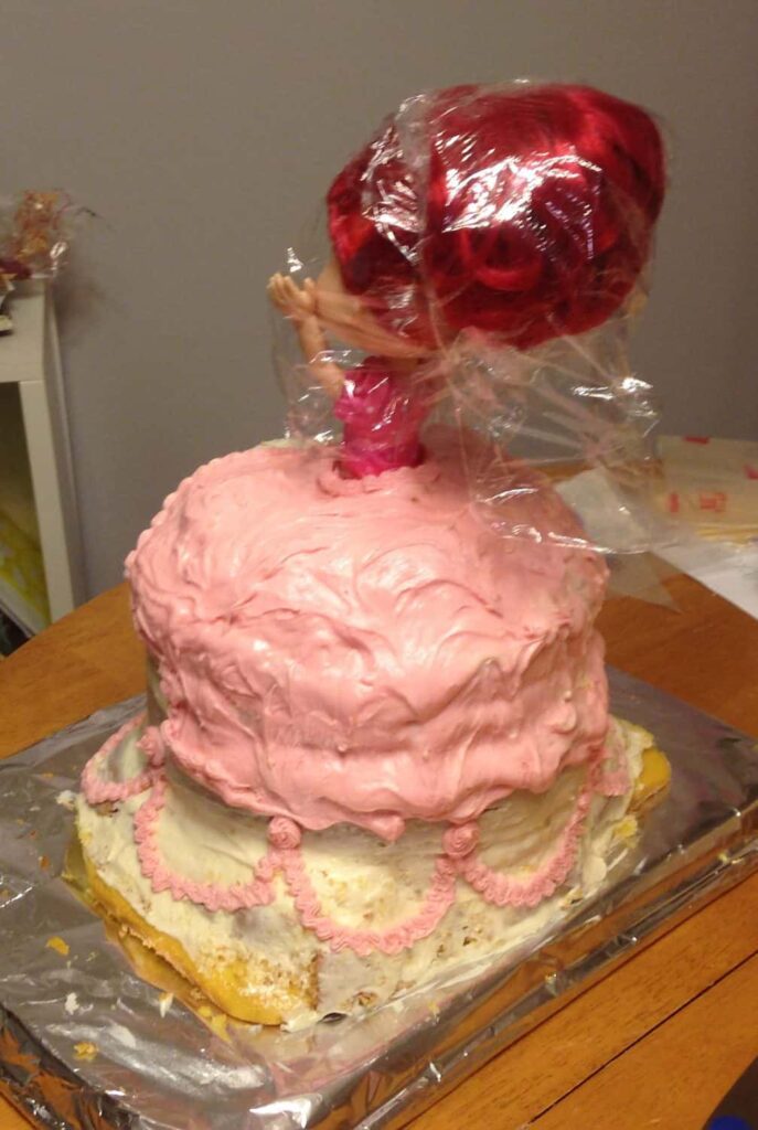 Strawberry Shortcake Doll Princess Cake https://www.b4andafters.com frosting a doll cake