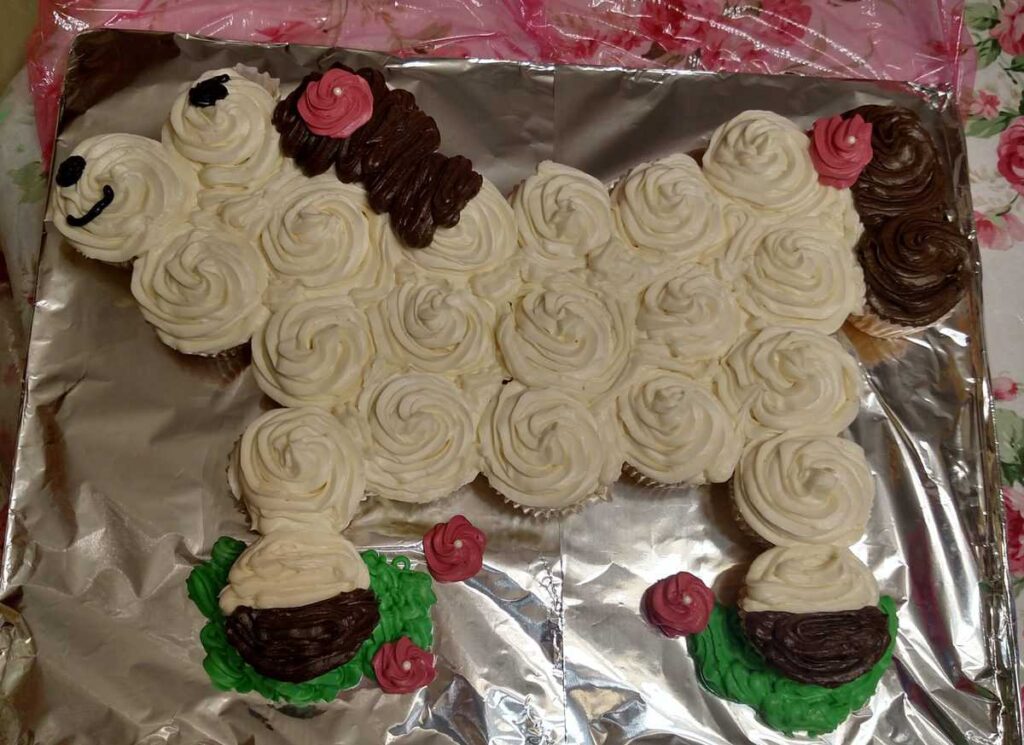 Cupcakes frosted to look like a white horse with a brown mane and tail