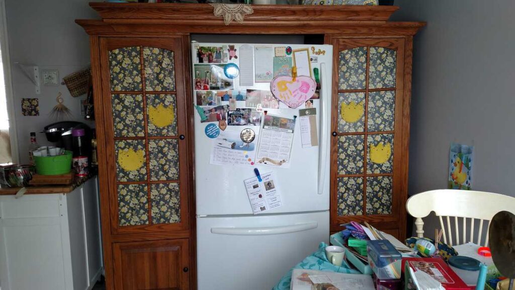 fridge between two pantry cabinets 