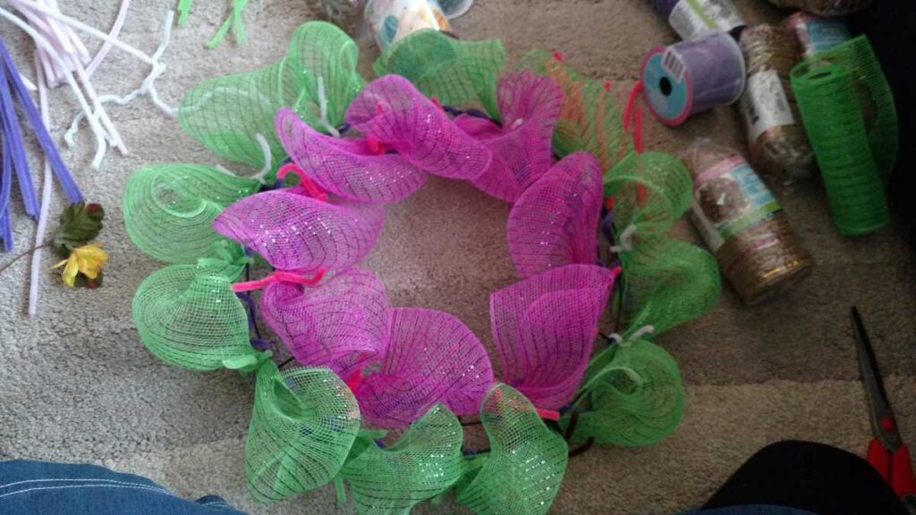 Easter Wreath Made With Dollar Tree Items https://www.b4andafters.com twist tie deco mesh