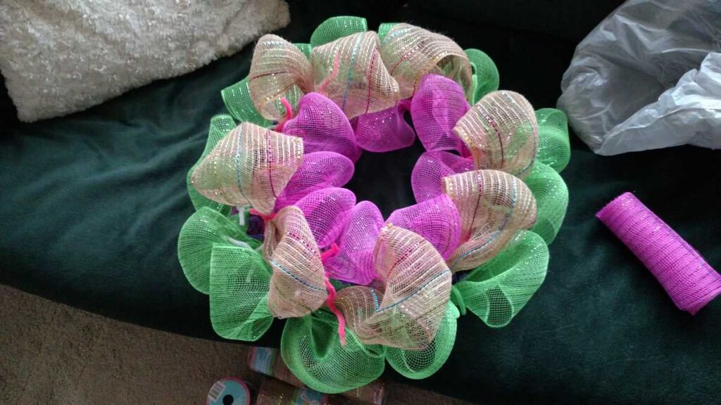 Easter Wreath Made With Dollar Tree Items https://www.b4andafters.com pink and green deco mesh wreath
