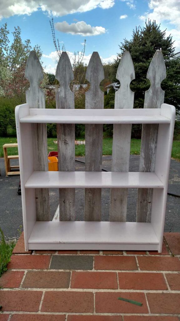 adding fence pickets to a bookcase outside