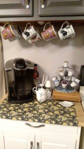 Coffee Station area with coffee maker, mugs, and coffee