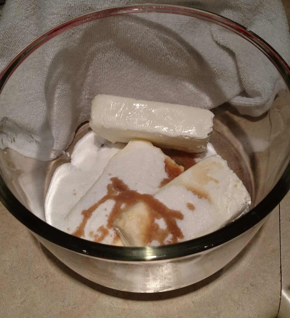 cream cheese, sugar, and vanilla in a clear bowl