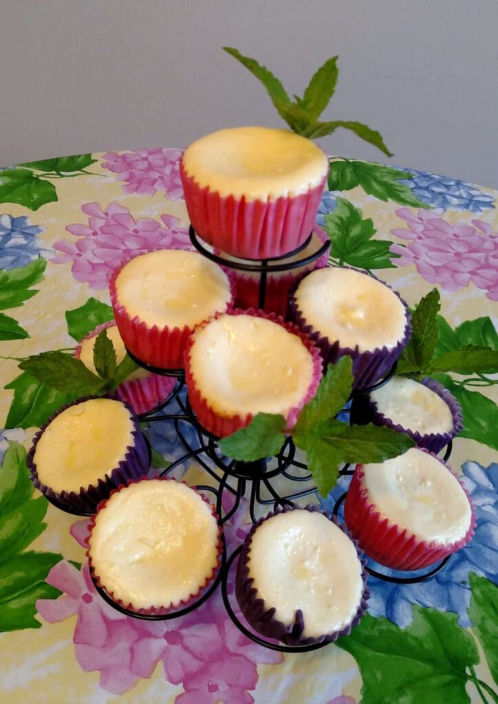 miniature cheesecakes on a tiered cupcake stand