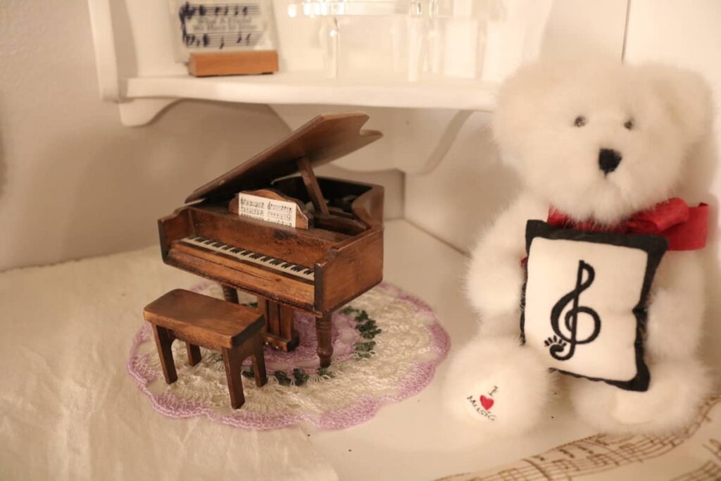 Piano Decor https://www.b4andafters.com wooden piano music box and white teddy bear