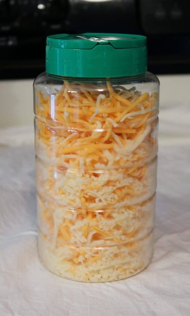 closeup of shredded cheese container