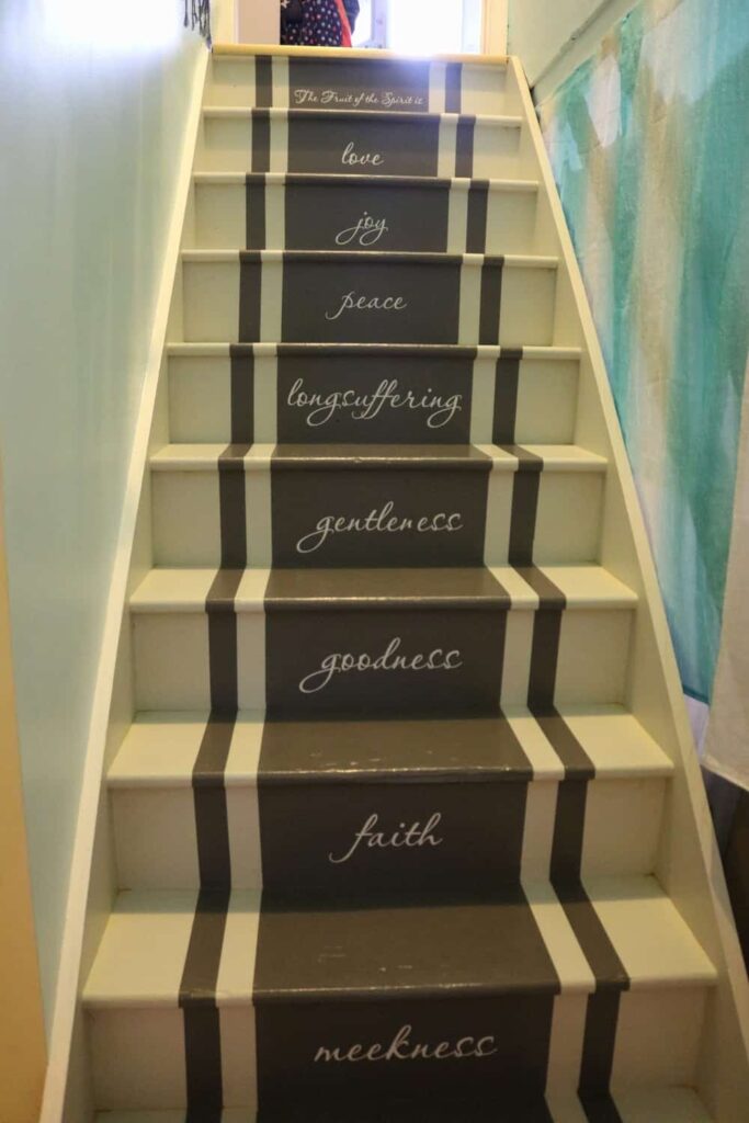 Adding Vinyl Stickers to the Basement Stairs https://www.b4andafters.com fruit of the spirit stickers on stairs