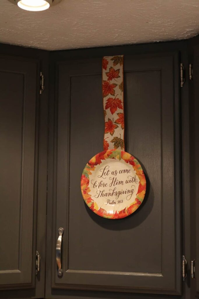Thanksgiving Kitchen/ Fall Decor https://www.b4andafters.com thankgiving paper plate on kitchen cabinet