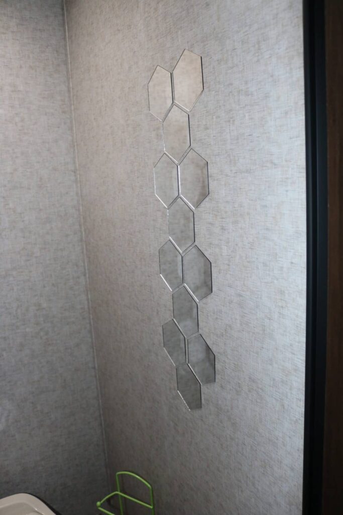 hexagon shaped mirrors on wall