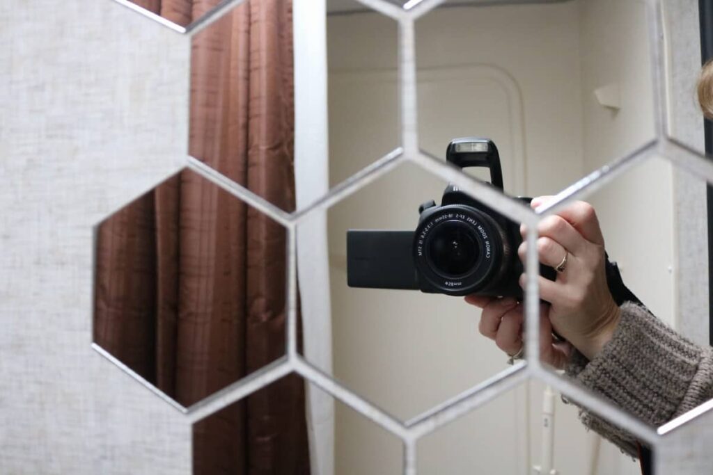 Lightweight Camper Bathroom Mirrors https://www.b4andafters.com hexagon mirrors showing a camera and hand