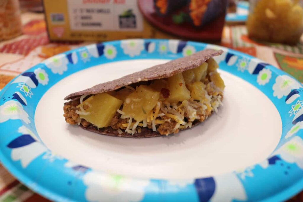 The Right Way to Fill a Taco https://www.b4andafters.com taco with cheese and pineapple