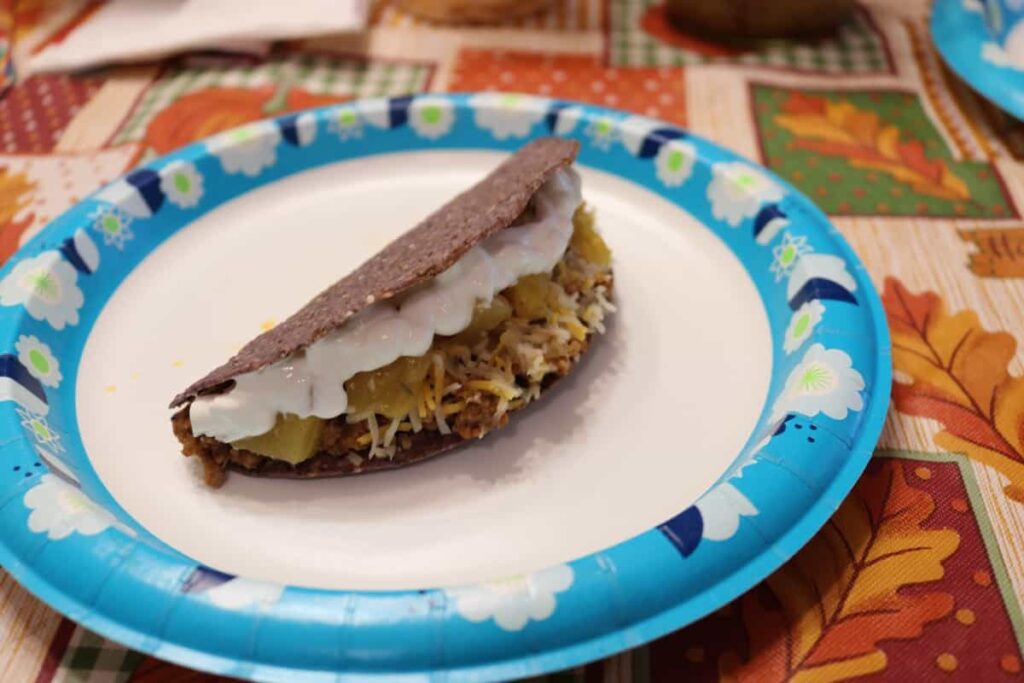 The Right Way to Fill a Taco https://www.b4andafters.com blue corn taco with sour cream and other toppings