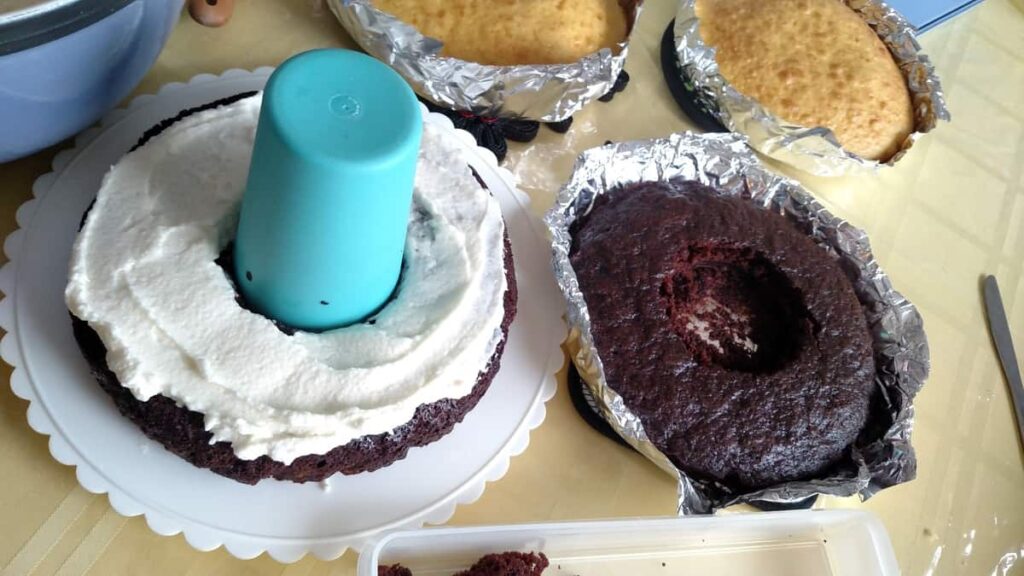 Sword Cake https://www.b4andafters.com using a cup to cut a hole out of a cake