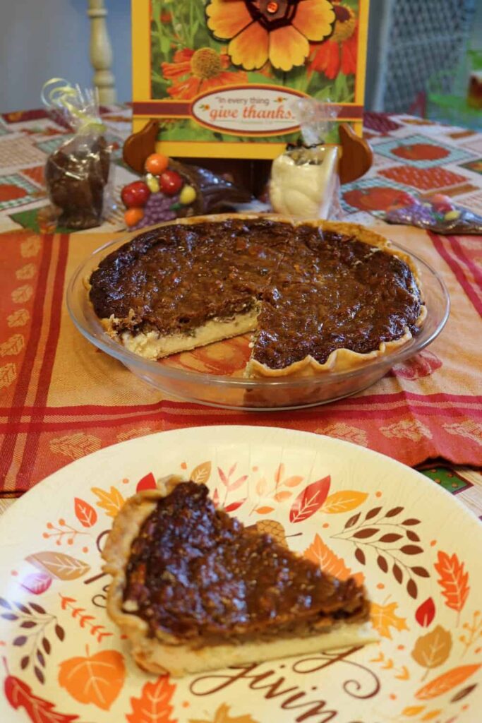 pie with piece cut out of it, and pie piece on paper plate in foreground