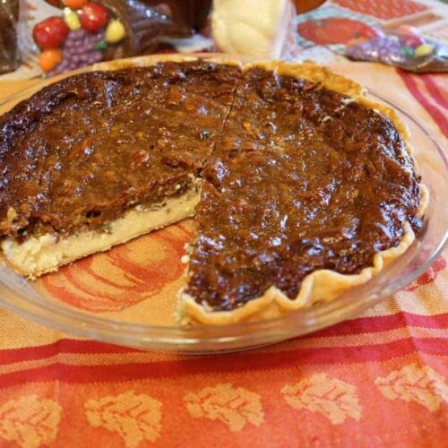 pecan cheesecake pie with slice taken out