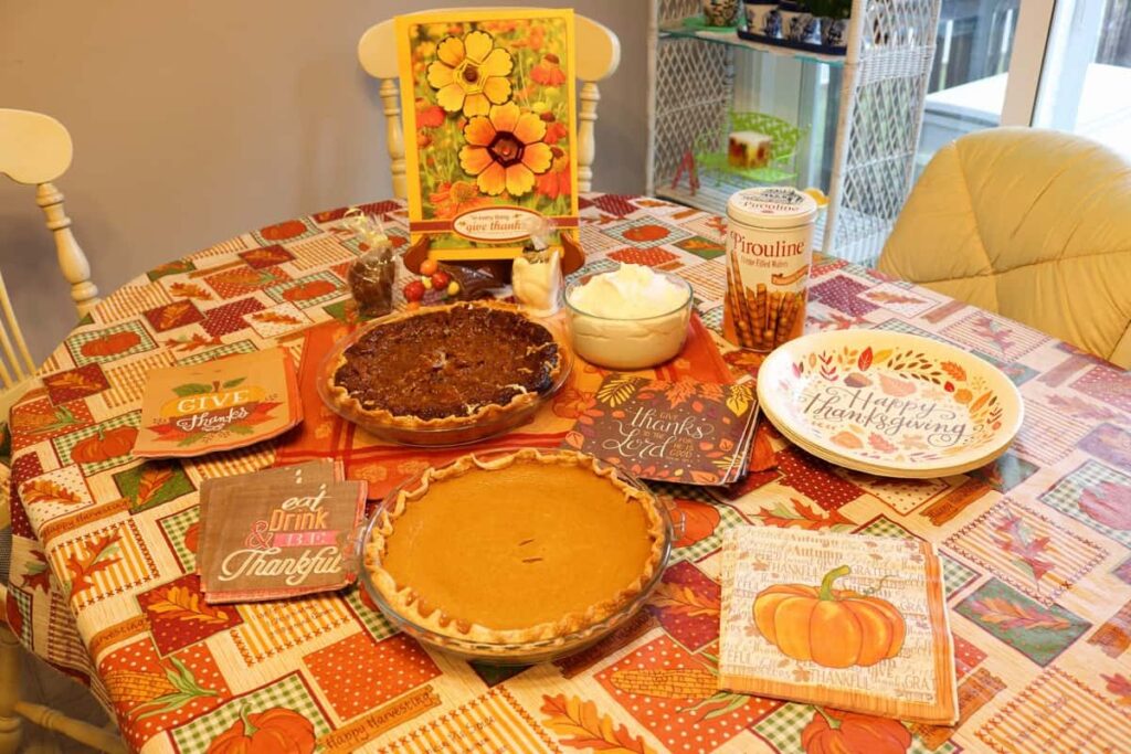 dessert table for thanksgiving including pies