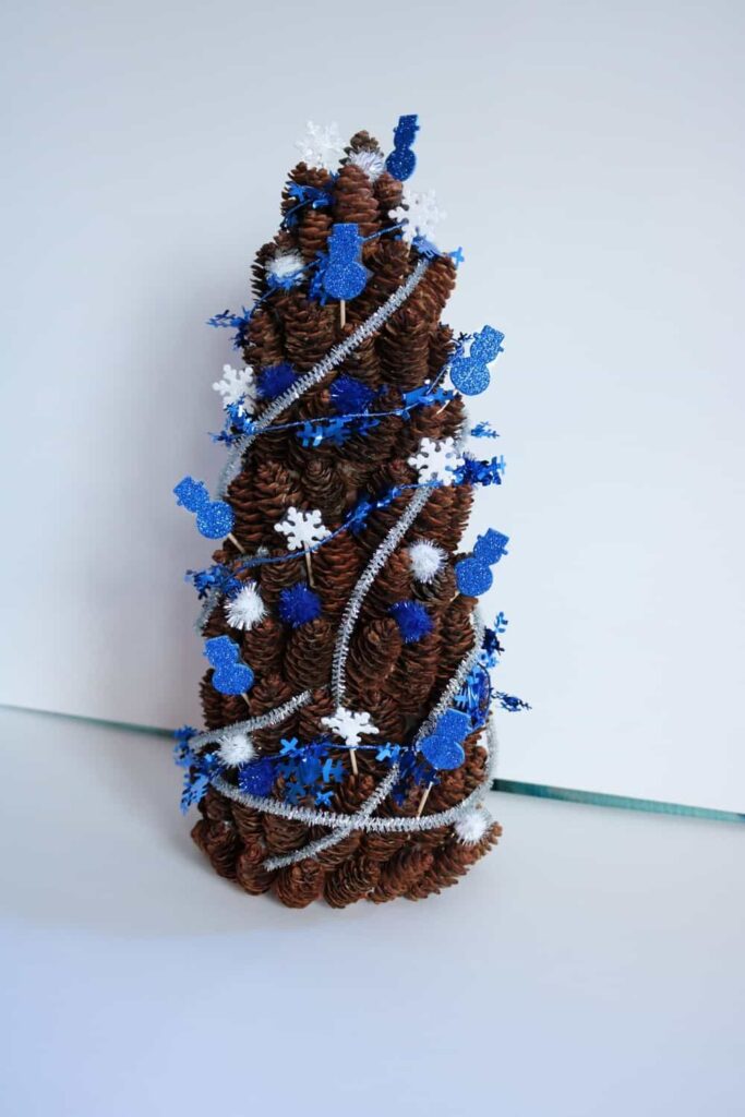 blue and white winter pine cone tree