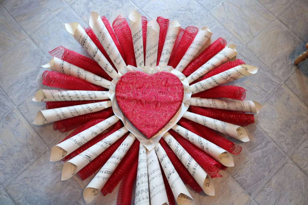 LOVE Sheet Music Wreath https://www.b4andafters.com/love-sheet-music-wreath huge sheet music wreath with deco mesh