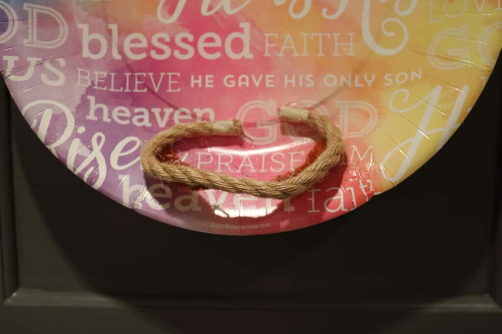 Easy Easter Kitchen Cabinet Decor https://www.b4andafters.com second step to marshmallow Peeps nest, add rope to pipe cleaner
