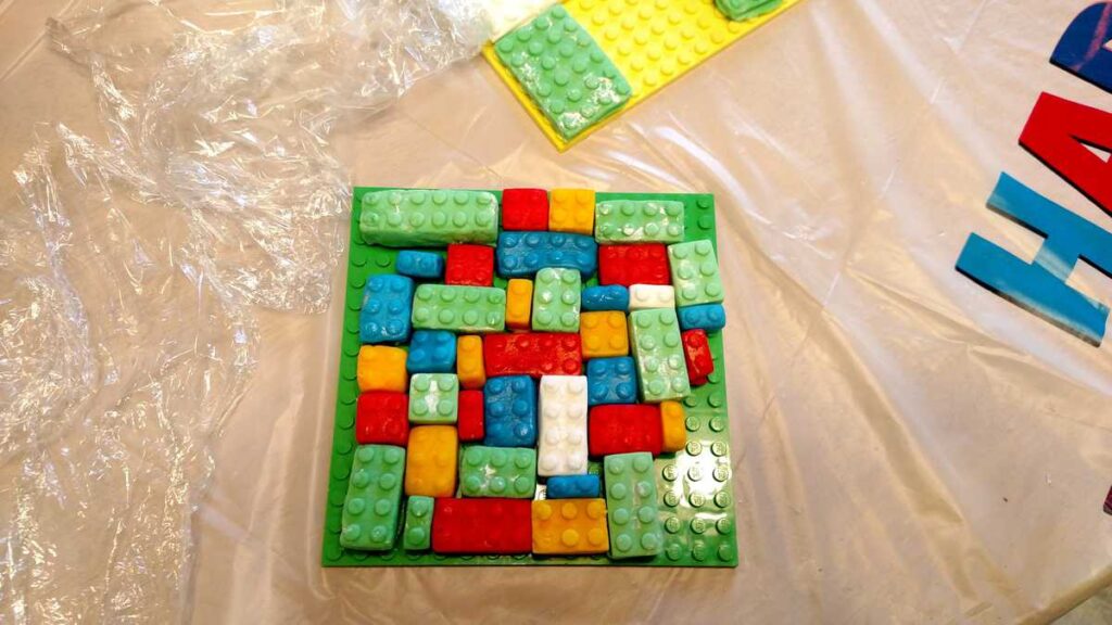 green, red, blue, yellow, and white fondant lego blocks