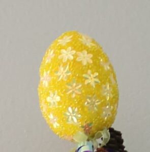 closeup of faux yellow beaded Easter egg