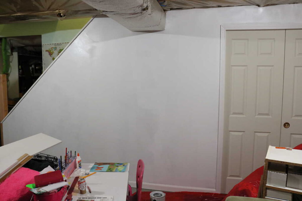 Pocket Doors in Basement Wall https://www.b4andafters.com priming basement wall