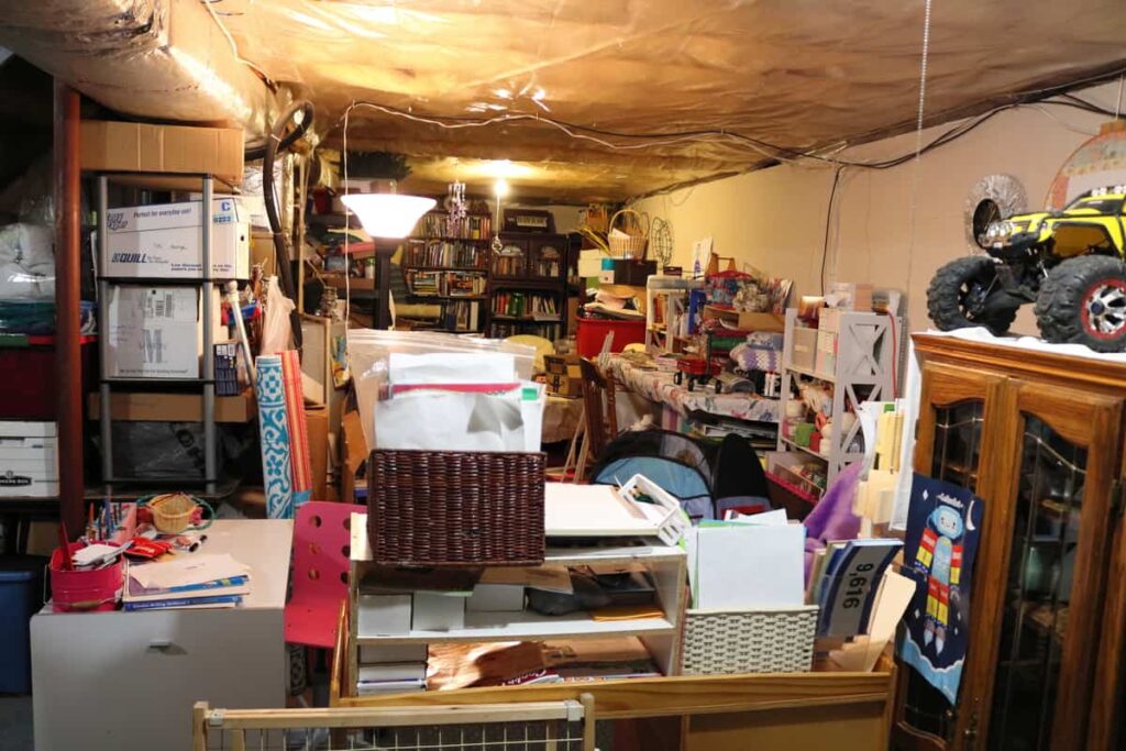Pocket Doors in Basement Wall https://www.b4andafters.com messy basement before new wall is added