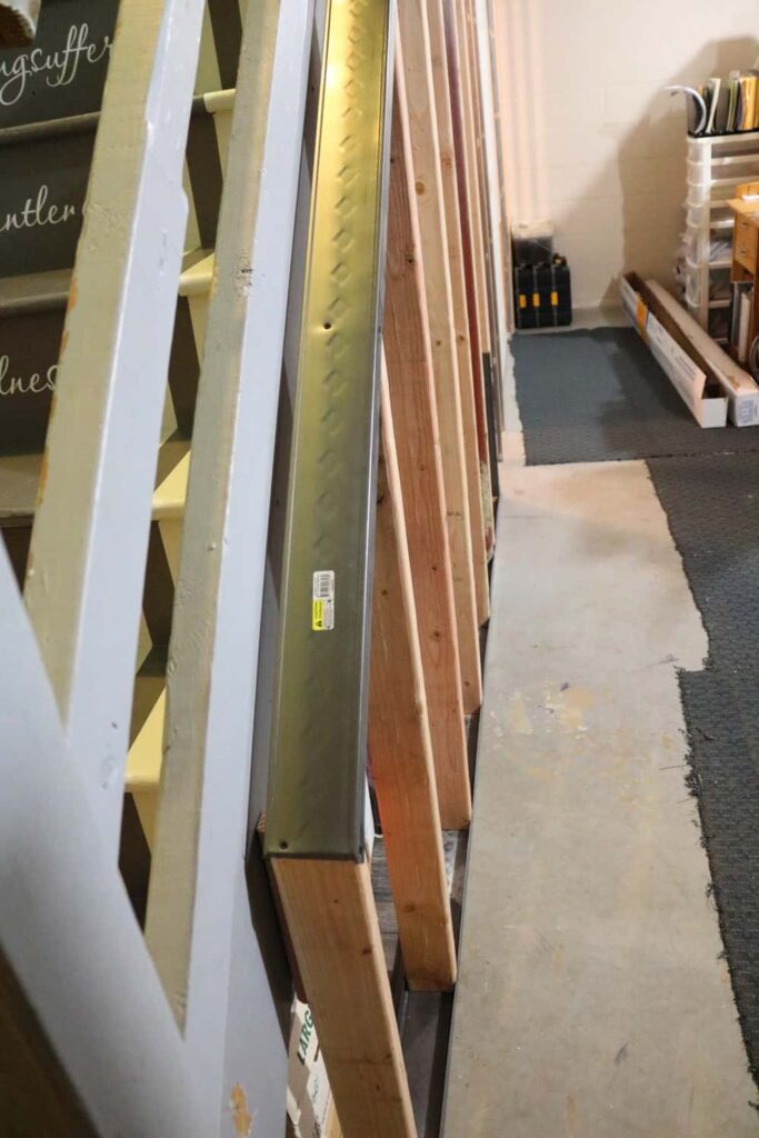 Pocket Doors in Basement Wall https://www.b4andafters.com using metal to frame basement wall