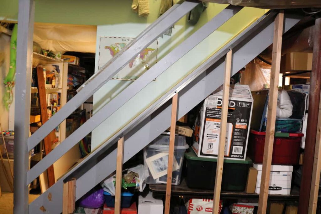 Pocket Doors in Basement Wall https://www.b4andafters.com framing out basement wall by stairs